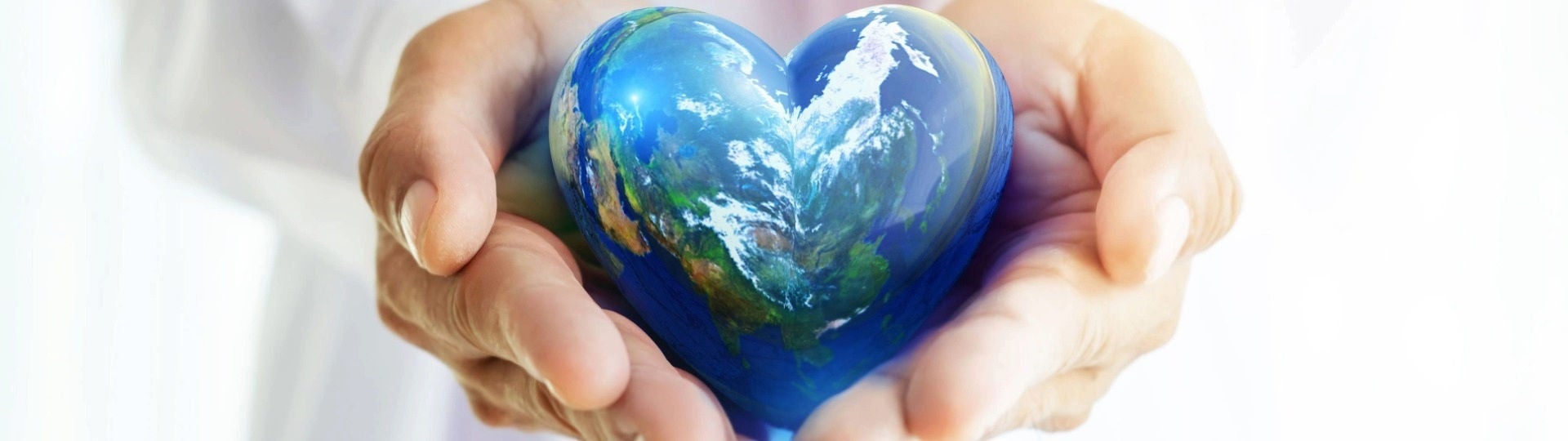 Doctor with globe shaped like a heart