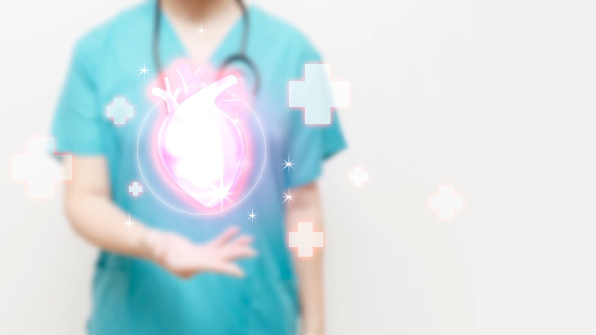 Medizinisches Personal mit Stethoskop und Herz im Vordergrund